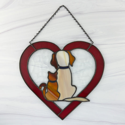 Stained glass heart-shaped suncatcher with a dog and cat on a white background.
This is the back view.