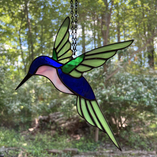 Hovering Hummingbird in Greens, Blue, Pinkish Purple