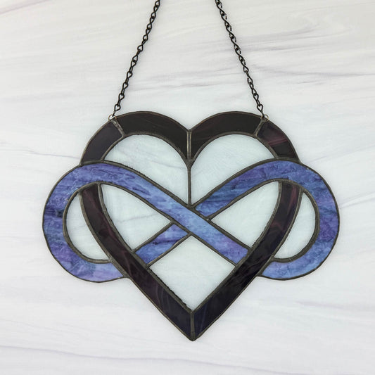 The opposite side of the stained glass heart with infinity symbol suncatcher on a white background