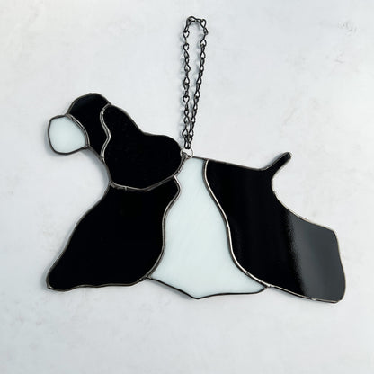 Stained Glass Suncatcher of an American Cocker Spaniel Black and White Parti dog in full competition mode.  The ear is made with a rippled black textured glass making it appear realistic.  This is the back side of the suncatcher