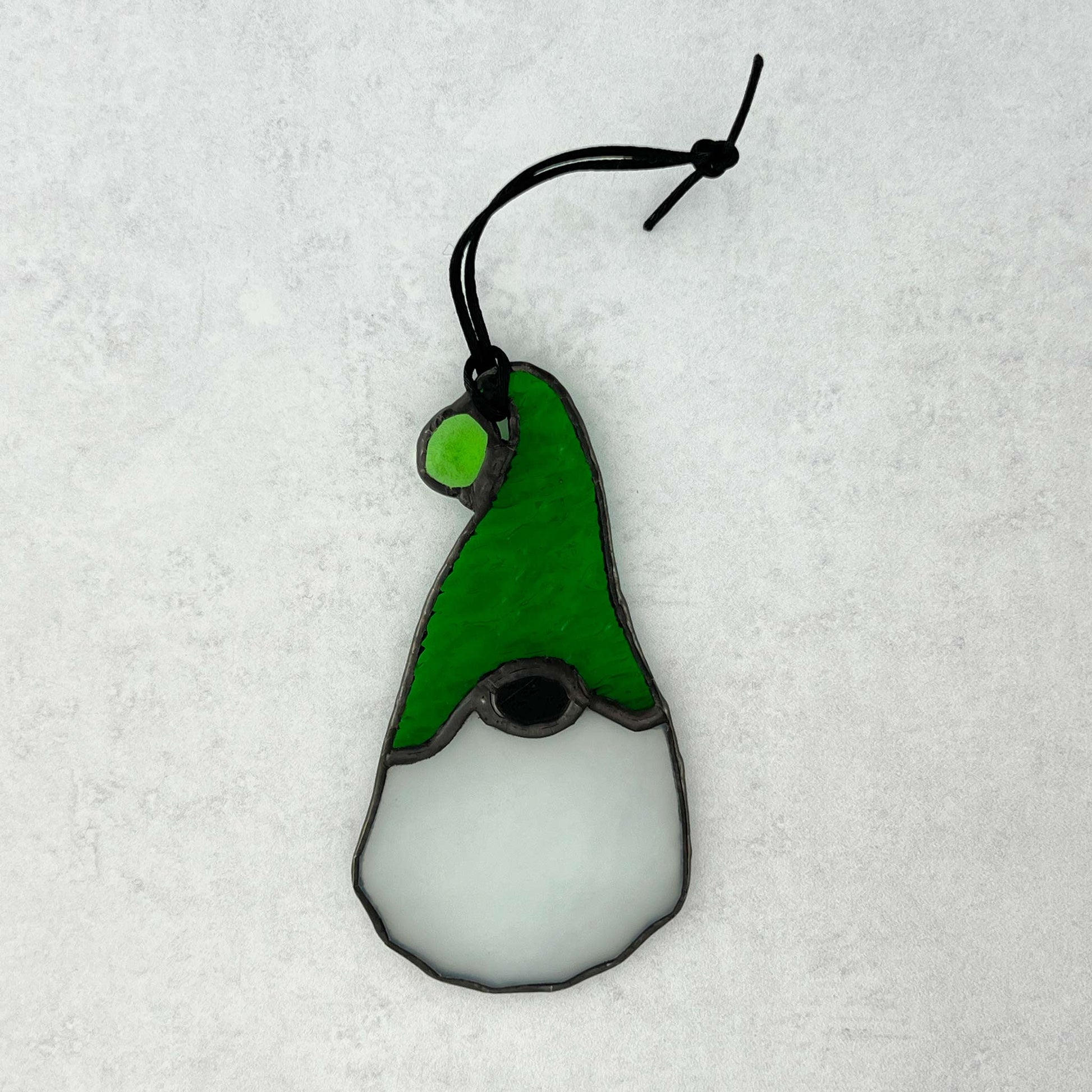 Back side of a stianed glass gnome ornament