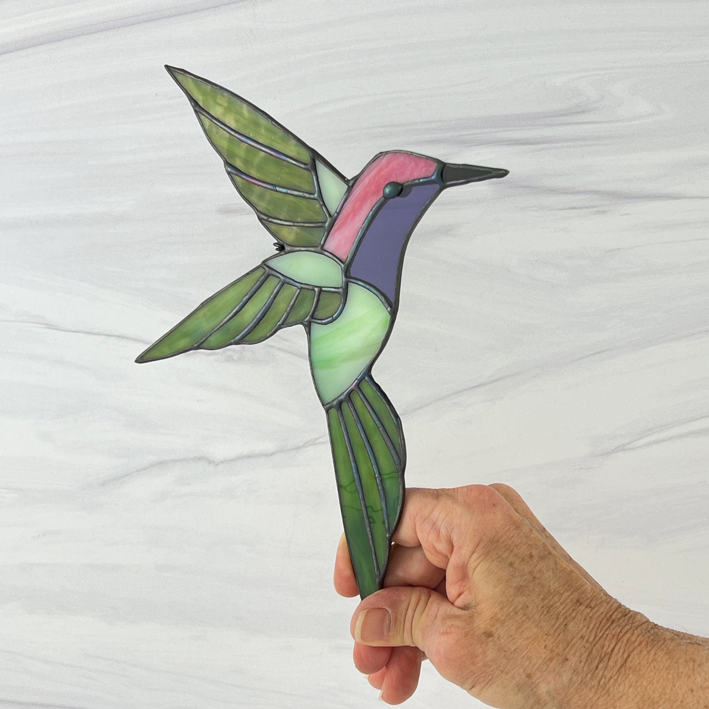Hovering Hummingbird in Greens, Pink, Purple