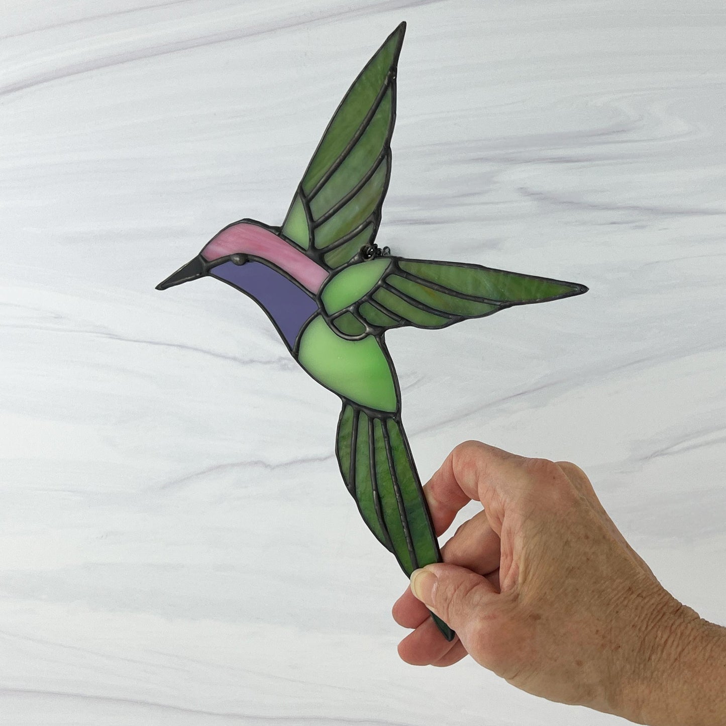 Hovering Hummingbird in Greens, Pink, Purple