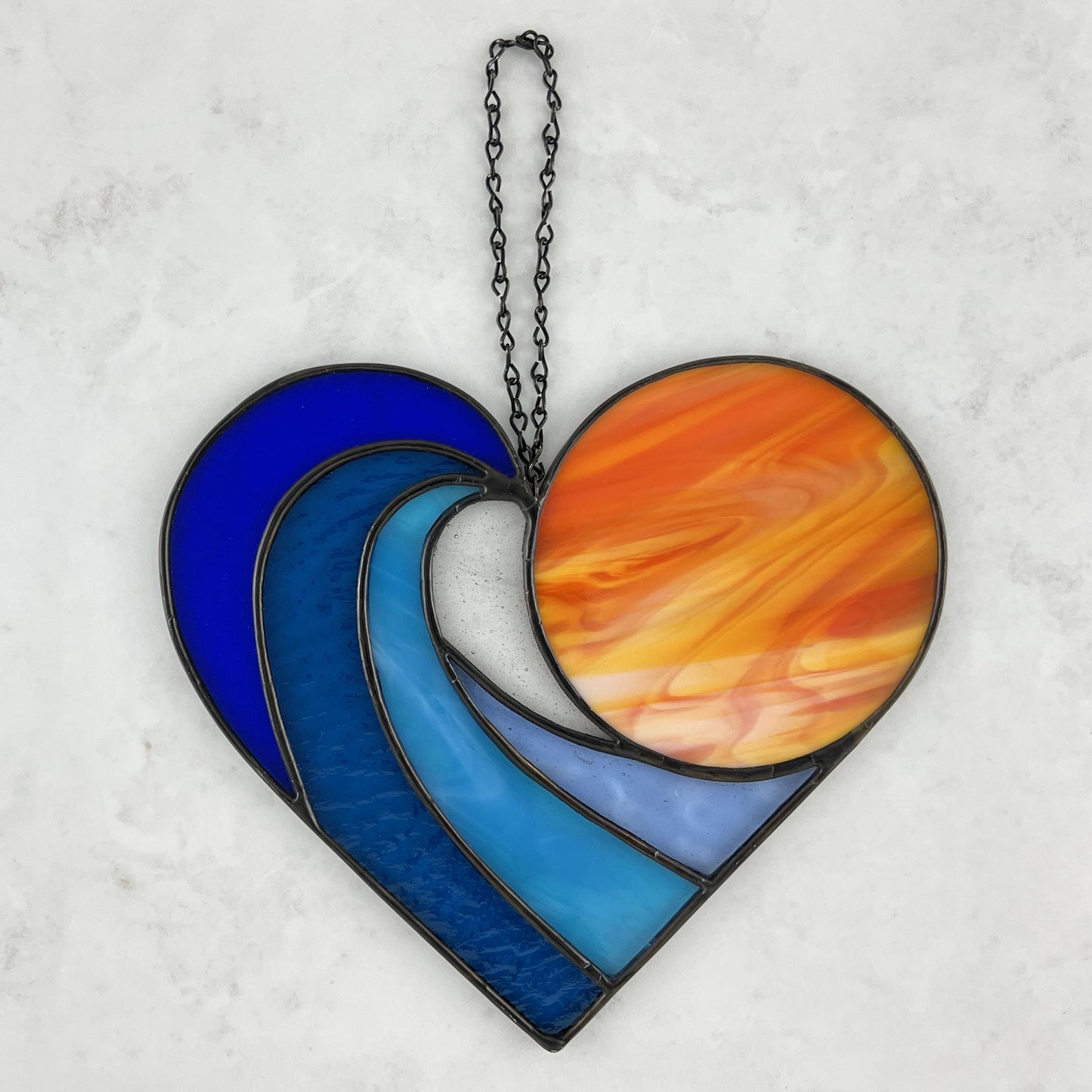 Sunset over the Ocean Waves Suncatcher